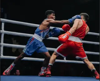 India's Vishvanath Suresh celebrates after winning his opening bout at the U-23 Asian Boxing Championships in Jakarta.