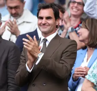 Jannik Sinner celebrates after defending his Wimbledon men's singles title in 2026.